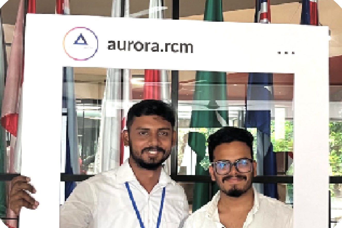 Two team members posing with the aurora.rcm photo frame